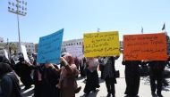 Women carry banners during a funeral ceremony for those died in attacks by Khalifa Haftar forces at the Abu Salim neighborhood's Martyrs Square, Tripoli, Libya, April 17, 2019. Hazem Turkia/ Anadolu Agency