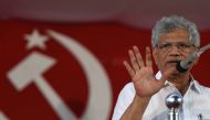 In this photo taken on April 19, 2019, Sitaram Yechury, leader of the Communist Party of India (Marxist), gestures to supporters at an election campaign rally in Perambra in the south Indian state of Kerala. AFP/Arun Sankar