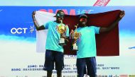 Qatar’s Ahmed Tijan (right) and Cherif Younousse pose with their trophies after winning the 2019 Asian Senior Beach Volleyball Championships final against hosts China in Maoming, yesterday. 