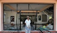 A man stands in front of the Abbraar Masjid mosque after a mob attack in Kiniyama, Sri Lanka May 13, 2019. (REUTERS/Dinuka Liyanawatte)
