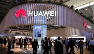 Visitors walk next to Huawei booth at the Mobile World Congress in Barcelona, February 27, 2019. Reuters/Rafael Marchante