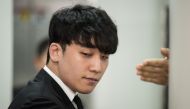  Former BIGBANG boyband member Seungri, real name Lee Seung-hyun, arrives at the High Court in Seoul on May 14, 2019. / AFP / Ed JONES 
