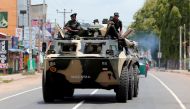 Sri Lankan soldiers patrol a road of Hettipola after a mob attack in a mosque in the nearby village of Kottampitiya, Sri Lanka May 14, 2019. REUTERS/Dinuka Liyanawatte