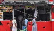 People view a damaged shop after a mob attack in Minuwangoda on May 14, 2019. (AFP / LAKRUWAN WANNIARACHCHI)
 