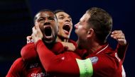 Liverpool's Georginio Wijnaldum celebrates scoring their third goal with Jordan Henderson and Trent Alexander-Arnold REUTERS/Phil Noble/File Photo