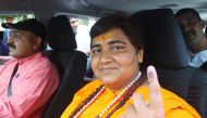 Pragya Singh Thakur, leader of ruling Bharatiya Janata Party (BJP), shows her ink-marked finger after casting her vote, outside a polling station in Bhopal, India, May 12, 2019. (REUTERS/Raj Patidar)