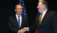 In this file photo taken on May 6, 2019, US Secretary of State Mike Pompeo (R) shakes hands with Russia's Foreign Minister Sergei Lavrov as they meet on the sidelines of the Arctic Council Ministerial Meeting in Rovaniemi, Finland. / AFP / POOL / MANDEL N