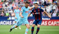Atletico Madrid's Spanish midfielder Koke (L) challenges Levante's Macedonian midfielder Enis Bardhi during the Spanish League football match between Levante and Atletico Madrid at the Ciutat de Valencia stadium in Valencia on May 18, 2019. / AFP / JOSE J