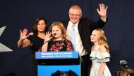 Australia's Prime Minister Scott Morrison (2R) waves to his supporters following a victory speech with his family after winning the Australia's general election in Sydney on May 18, 2019. (AFP / Saeed KHAN)
