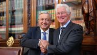 Handout picture released by the Mexican presidency showing Mexican President Andres Manuel Lopez Obrador (L) shaking hands with US actor Richard Gere after a private meeting at the Palacio Nacional in Mexico City on May 14, 2019. 