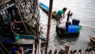This photo taken on February 3, 2019 shows residents using an artesian well pump in Sitio Pariahan, Bulacan.  AFP / Noel Celis