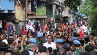Indonesian President Joko Widodo (C) visits a neighbourhood in Jakarta on May 21, 2019. AFP / AZWAR IPANK