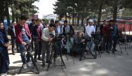 Afghan journalists gather during a news report at the Shahr-e-Naw Park in Kabul on April 30, 2019. AFP / Wakil Kohsar