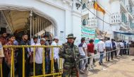 Sri Lankan police officers stand guard outside a Sufi Islamic mosque during Friday Prayer in Colombo, Sri Lanka on May 17 , 2019.  Chamila - Anadolu