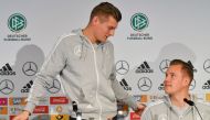 FILE PHOTO: Marc-Andre Ter Stegen (R), goalkeeper of the German national football team, and the team's midfielder Toni Kroos attend a press conference on the eve of the team's international friendly match against Spain in Duesseldorf, western Germany. AFP