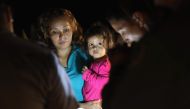 Central American asylum seekers including a Honduran girl and her mother near the US-Mexico border in McAllen, Texas on June 12, 2018. AFP/Getty Images North America/John Moore