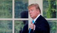 US President Donald Trump gestures to news media outside the Oval Office as he returns to the White House after visiting Arlington National Cemetery in Washington, US, May 23, 2019. REUTERS/Carlos Barria