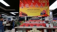 Books named 'Xi Jinping: Seven Years of Educated Youth' piled up as the Tiananmen Rostrum in China's northern Hebei province on September 24, 2017. (AFP) 