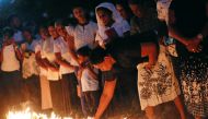 Devotees light candles while praying in front of St. Sebastian church, one of the churches attacked in the April 21st Easter Sunday Islamic militant bombings, during the first-month remembrance service in Negombo, Sri Lanka May 21, 2019. REUTERS/Dinuka Li