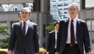 Former Nissan Motor Co. Chairman Carlos Ghosn and his lawyer Junichiro Hironaka arrive at the Tokyo District Court for the first pretrial procedures in his financial misconduct case, in Tokyo, Japan, May 23, 2019, in this photo taken by Kyodo