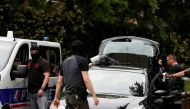 Investigators are seen during a police operation in Oullins, near Lyon, France May 27, 2019. REUTERS/Emmanuel Foudrot