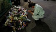 A local resident prays to mourn victims at the site where a stabbing occured in Kawasaki, Japan, May 28, 2019. REUTERS/Issei Kato