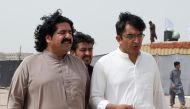 FILE PHOTO: Ali Wazir (L) and Mohsin Dawar, leaders of the Pashtun Tahaffuz Movement (PTM) walk at the venue of a rally against, what they say, are human rights violations by security forces, in Karachi, Pakistan May 13, 2018. Picture taken May 13, 2018. 