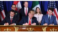 FILE PHOTO: Mexico President Enrique Pena Nieto, US President Donald Trump and Canadian Prime Minister Justin Trudeau sign a new free trade agreement in Buenos Aires on November 30, 2018. AFP / Saul Loeb