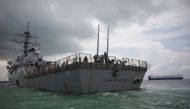 FILE PHOTO: The U.S. Navy guided-missile destroyer USS John S. McCain is seen after a collision, in Singapore waters August 21, 2017. REUTERS/Ahmad Masood/File Photo