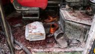 A sandal and shoes belonging to the victims lay inside damaged bus carrying university students in Kabul on June 2, 2019.  AFP