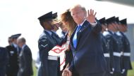 US President Donald Trump (R) and US First Lady Melania Trump (L) disembark Air Force One at Stansted Airport, north of London on June 3, 2019, as they begin a three-day State Visit to the UK.   AFP / MANDEL NGAN