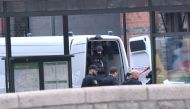 Police members are seen at Malmo central station after shooting a man for 