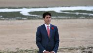 Canadian Prime Minister Justin Trudeau stands after laying a wreath during an international D-Day commemoration ceremony on Juno Beach in Courseulles-sur-Mer, France June 6, 2019. Fred Tanneau/Pool via REUTERS
