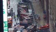 Emergency vehicles are seen outside 787 7th Avenue in midtown Manhattan where a helicopter crashed in New York City, New York, U.S., June 10, 2019. REUTERS/Mike Segar