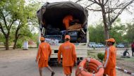 Personnel from India's 6th National Disaster Response Force (NDRF) load life saving material on a truck at a NDRF camp, in Chiloda (also called Naroda), some 40 kms from Ahmedabad on June 11, 2019.  AFP / SAM PANTHAKY