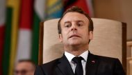 French President Emmanuel Macron grimaces before his speech before the International Labour Organization (ILO) Conference on June 11, 2019 in Geneva. / AFP / FABRICE COFFRINI
