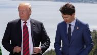 Trudeau's office said he will visit next Thursday. Trump and Trudeau are trying to build momentum to pass the new trade deal that also includes Mexico.