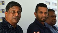 Sri Lanka's Cricket chairman of selector Ashantha de Mel (L) speaks as new (ODI) cricketer captain Dimuth Karunaratne (C) looks on during a press conference in Colombo on April 18, 2019.  AFP / Ishara S Kodikara