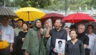 Pro-democracy legislators speak to the media demanding the Hong Kong Chief Executive Carrie Lam withdraw a controversial extradition bill outside Government House, following a day of violence over an extradition bill that would allow people to be sent to 