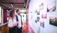 Football fans having a closer look at a set of crowdsourced photographs on display at the Qatar @roadto2022 Exhibition at JK Iguatemi Shopping mall in Sao Paulo, Brazil, yesterday. 