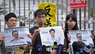 Members of pro-democracy party Demosisto (L-R) Nathan Law, Joshua Wong and Agnes Chow speak to the media after Chief Executive Carrie Lam held a press conference in Hong Kong on June 18, 2019.  AFP / Anthony WALLACE