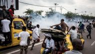 Supporters of Felix Tshisekedi celebrating and cheering in the street of Kinshasa on November 27, 2018. AFP/John Wessels
