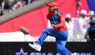 Afghanistan's Rashid Khan jumps as he fields the ball during the 2019 Cricket World Cup group stage match between England and Afghanistan at Old Trafford in Manchester, northwest England, on June 18, 2019. AFP / Dibyangshu Sarkar