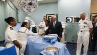 US Vice President Mike Pence greets Naval medical staff with his wife Karen as Navy Admiral Craig Faller, right, commander of the U.S. Souther Command looks on as he toured the US Navy Hospital Ship USNS Comfort on June 18, 2019 in Miami, Florida. Joe Ski