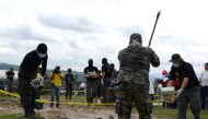 Anti-narcotics and Military Police officers prepare for the incineration of more than 200 kilos of cocaine seized in El Salvador (AFP) 