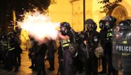 A riot policeman fires during a rally against a Russian lawmaker's visit in Tbilisi, Georgia June 21, 2019. Reuters/Irakli Gedenidze