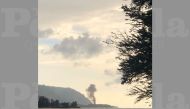 A plume of smoke rises after an airplane crash, seen from Kaiaka Bay Beach Park, in Haleiwa, Hawaii, U.S., June 21, 2019 in this image obtained from social media. LuckyWeLive.com via REUTERS 