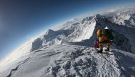 In this file photo taken on May 17, 2018 mountaineers make their way to the summit of Mount Everest, as they ascend on the south face from Nepal.  AFP / Phunjo Lama
 