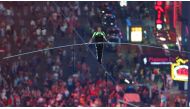 Aerialist Nik Wallenda walks the highwire with his sister Lijana (unseen) over Times Square in New York, U.S., June 23, 2019. REUTERS/Eduardo Munoz