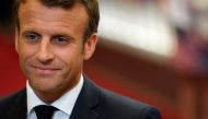 FILE PHOTO: French President Emmanuel Macron speaks to the press as he leaves after a European Union (EU) summit at the EU Headquarters in Brussels on the first day of a summit of EU leaders.  AFP / KENZO TRIBOUILLARD
